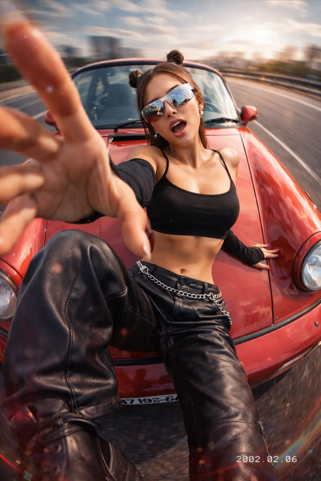Y2K fashion photo of a woman on a red Porsche with wide-angle drone perspective